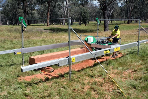 Lucas Mill 10-30 on its track cutting a long beam