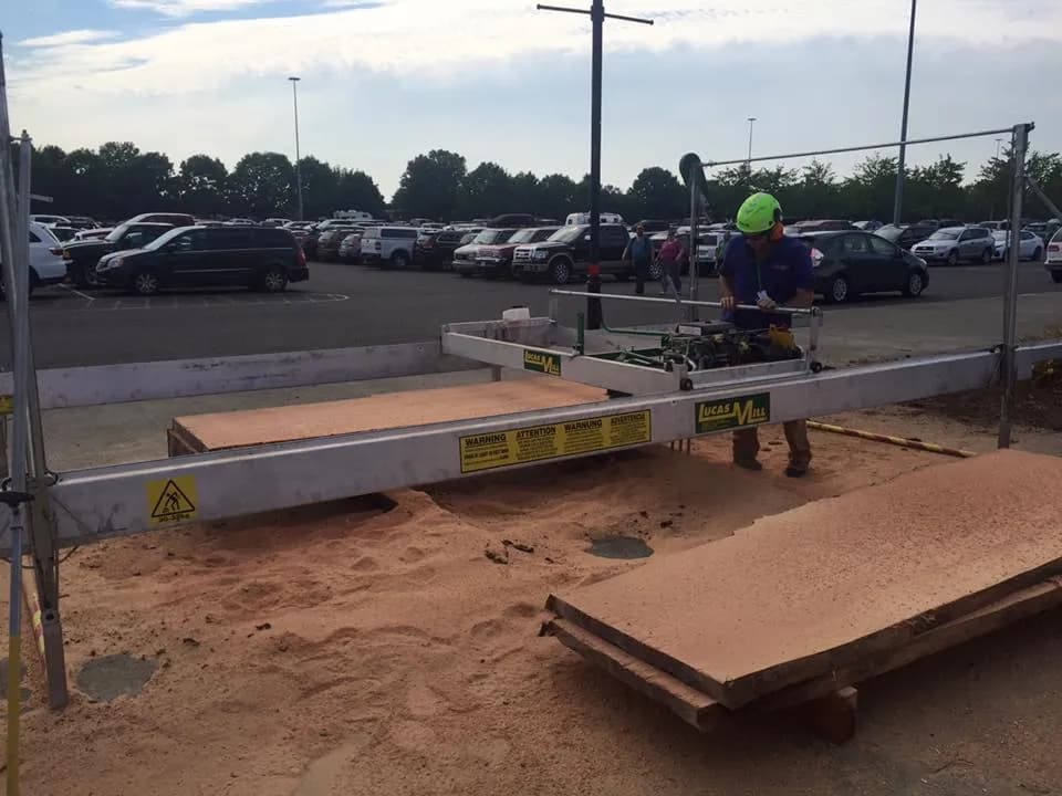 Sawn slabs on the sawdust beside a Lucas Mill at a Bailey's show