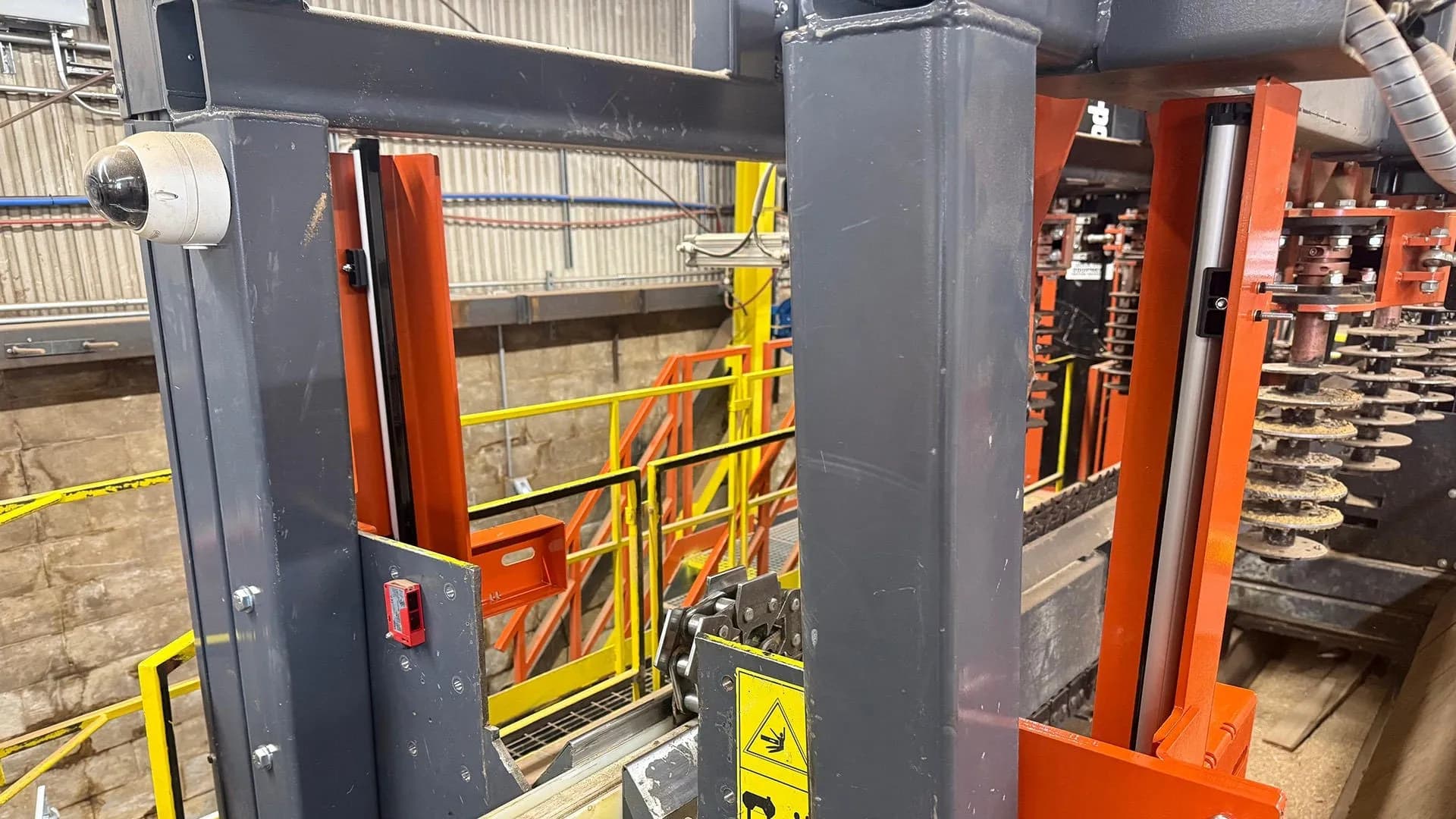 Wood-Mizer log tally scanner frame over a log conveyor in a mill
