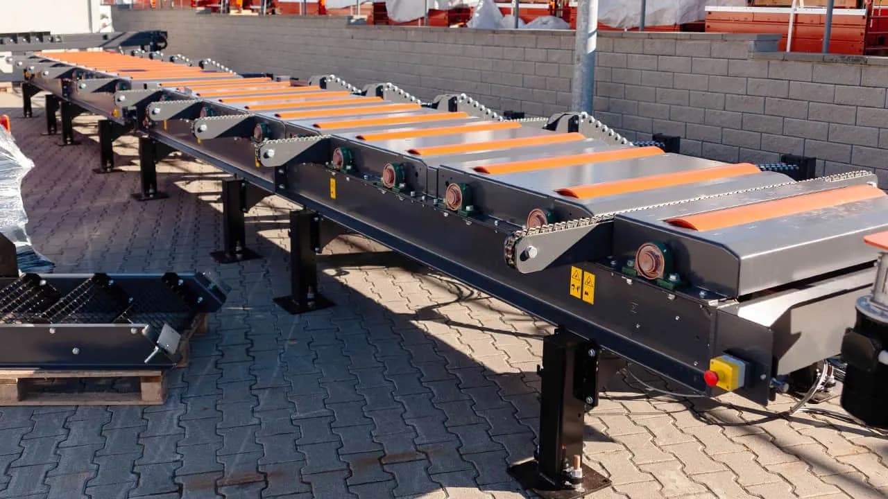 Wood-Mizer three-way sorting table outdoors on a paved yard